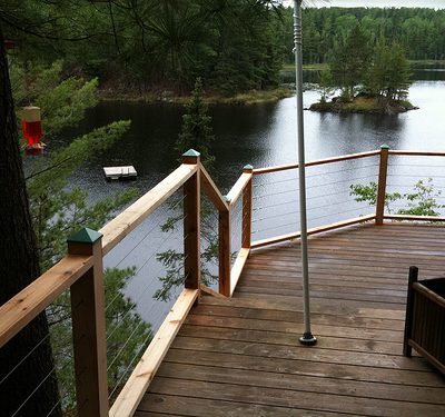 Deck railing added at cabin